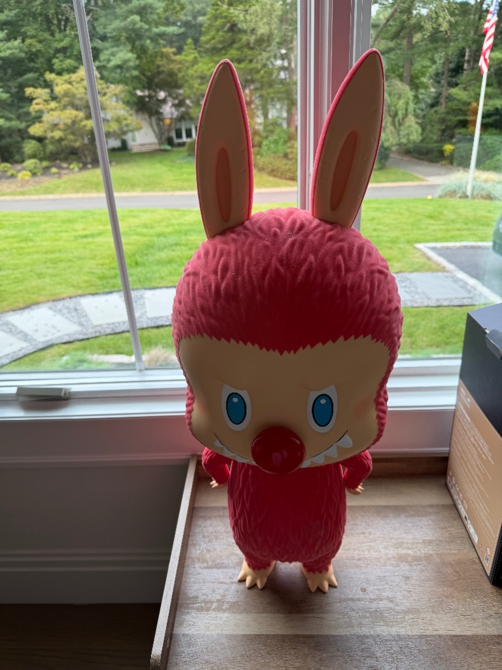 “MEGA LABUBU TEC All About Us” as a pink bunny-eared figure.